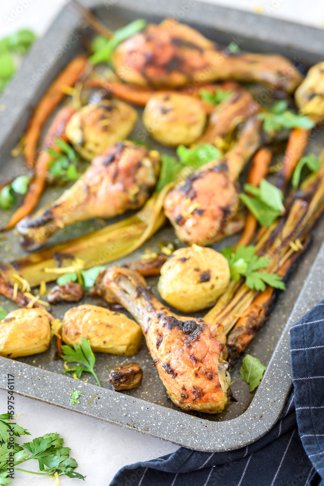 Baked chicken drumsticks with vegetables 