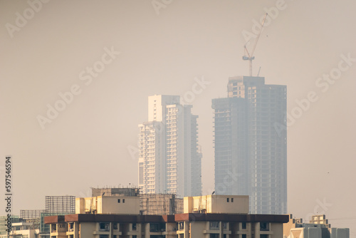 Skyline of tall high rise skyscrapers under construction in the polluted industrial smog in the suburb of Kandivali in Mumbai.