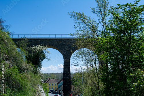 Obraz na płótnie Historic stone railway viaduct on a sunny day against a blue sky w salonie