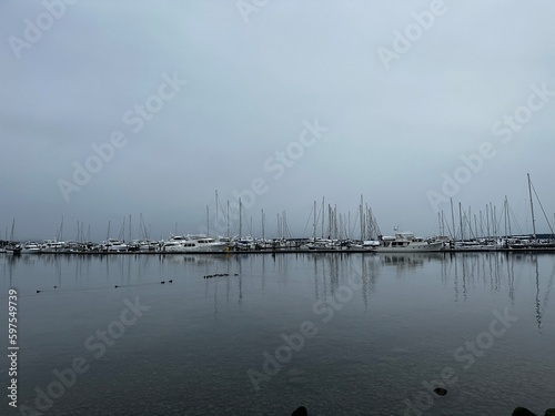 Sailboat reflections at Port Sidney Marina on a dreary dark and overcast day - Sidney, Vancouver Island, British Columbia, Canada © Sophia