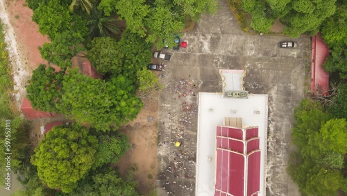 High-Angle Video of the Merit Making Ceremony, Buddhist Monk Ordination, Surat Thani Province, Near Tapee River photo