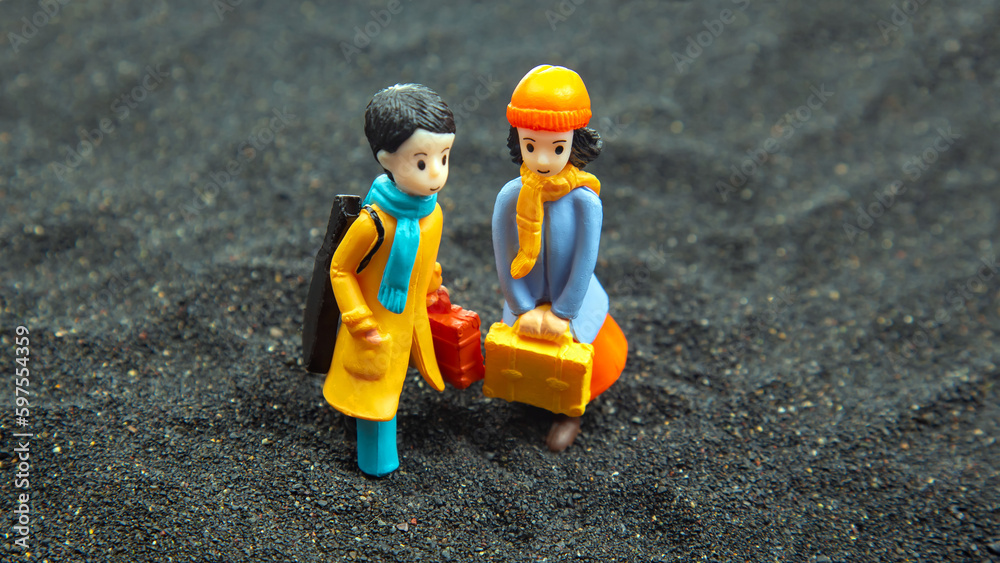 Naklejka premium miniature people. figures for the game. romantic couple of young people. boy and girl walking together