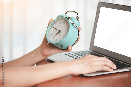 Woman's hand holding alarm ...