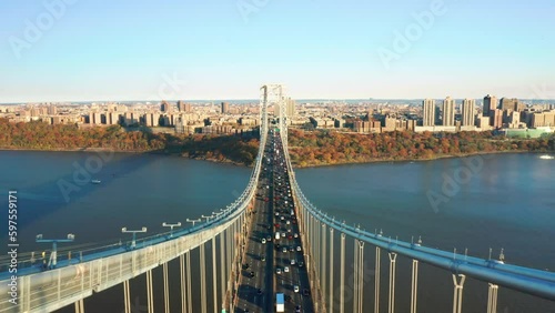 Aerial footage above George Washington Bridge with pull-back camera motion. The GWB is a double-decked suspension bridge spanning the Hudson River, connecting Fort Lee, NJ with New York City photo
