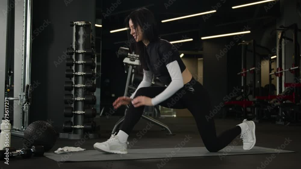 Fit woman Caucasian instructor trainer in sportswear training gluteal muscle legs exercise stretching body warm up practice yoga loss weight active sportswoman workout on fitness mat in sport club gym