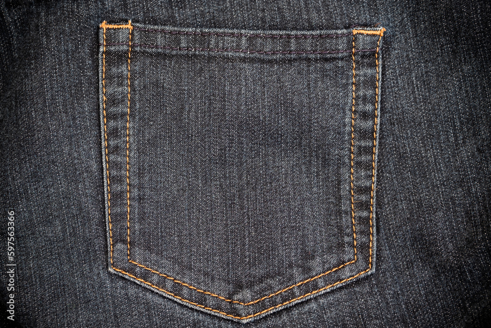 Closeup view of blue jeans. denim texture for traditional business background in cool vibrant colors Closeup view of blue jeans. denim texture for traditional business background in cool vibrant colors