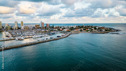 aerial of Punta del Este city Uruguay Atlantic coastline with scenic skyscraper building and skyline drone footage golden hours