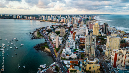 Aerial of Punta del Este Uruguay with cityscape drone fly above scenic skyline with modern skyscraper buildings photo
