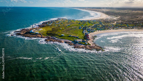 Aerial Drone Fly Above Rocky Peninsula and Ocean Shore of Cabo Polonio Uruguay  photo