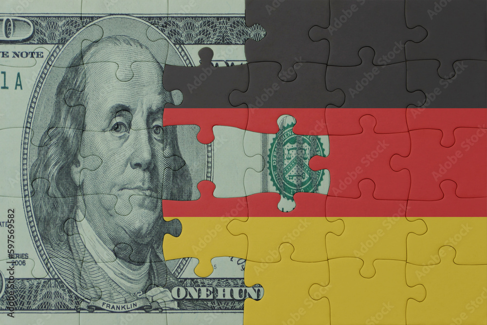 puzzle with the national flag of germany and dollar money banknote. macro.concept.