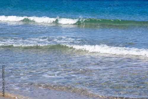 Striking scene of waves breaking on the sand of a Spanish beach