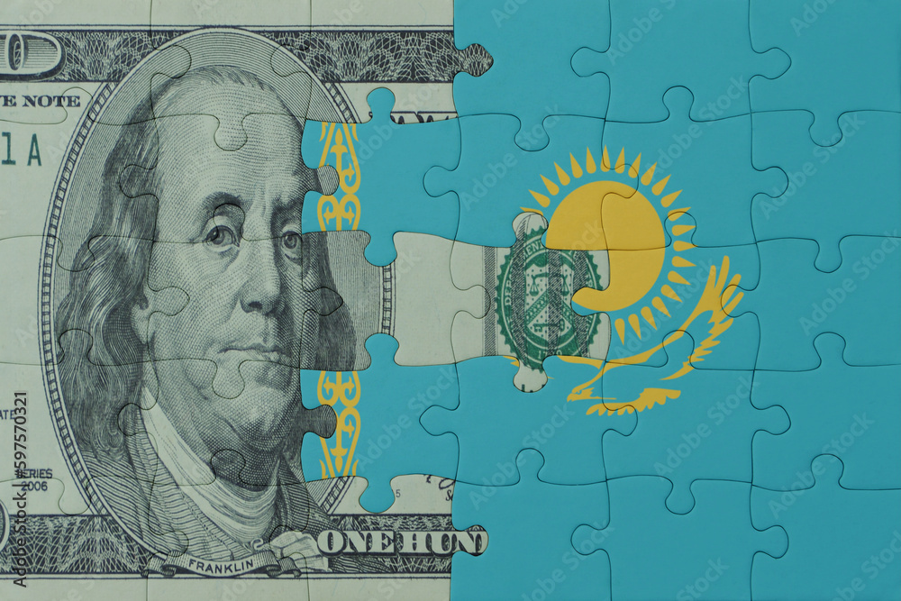 puzzle with the national flag of kazakhstan and dollar money banknote. macro.concept.