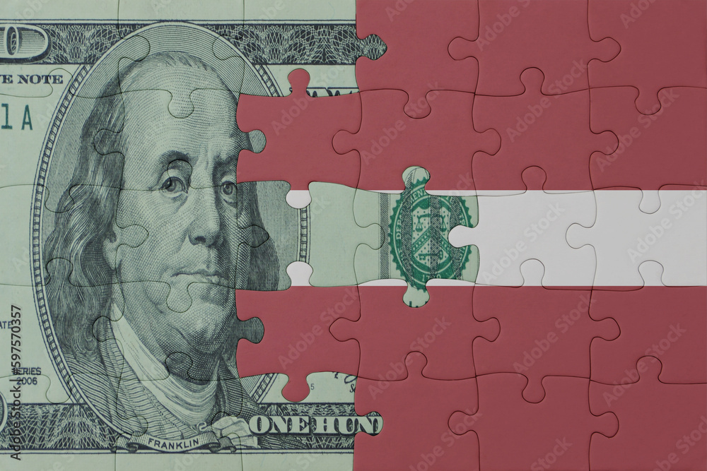 puzzle with the national flag of latvia and dollar money banknote. macro.concept.
