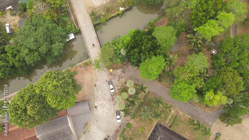 High-Angle Video of the Merit Making Ceremony, Buddhist Monk Ordination, Surat Thani Province, Near Tapee River photo