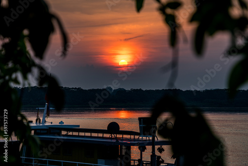 Sunset in pier of San Juan de Guaviare in Colombia photo