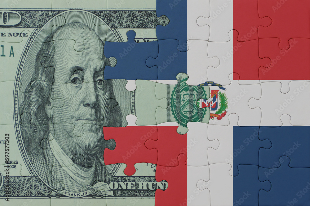 puzzle with the national flag of dominican republic and dollar money banknote. macro.concept. - obrazy, fototapety, plakaty 