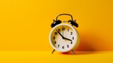 A alarm clock on a yellow background with copy space. Created with Generative AI Technology