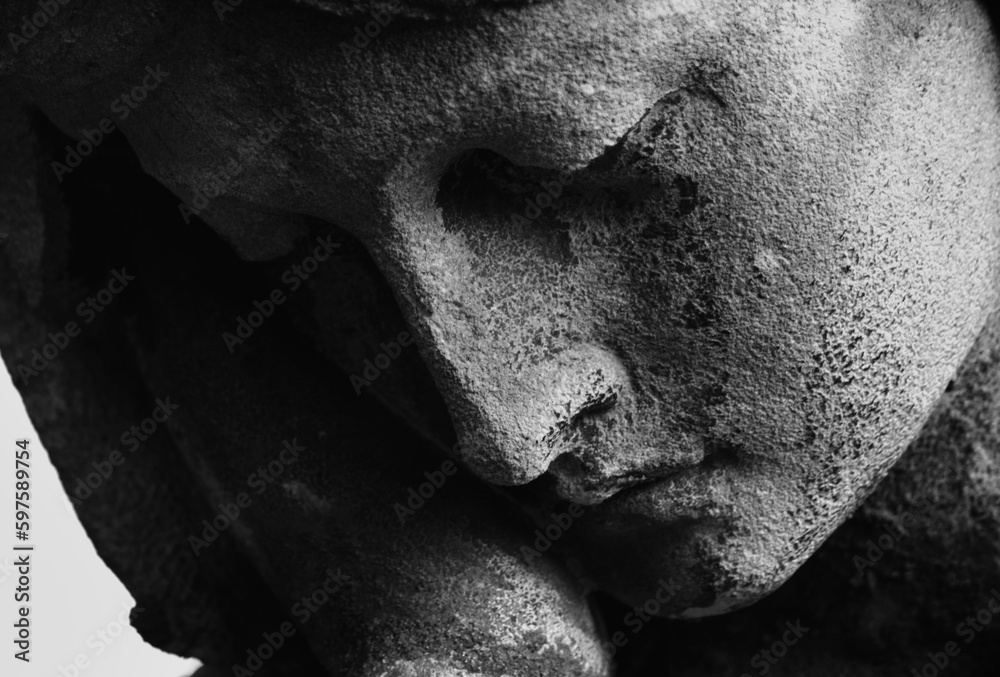 Fototapeta Antique statue of the Virgin Mary praying (religion, faith, holy) Black and white horizontal image.