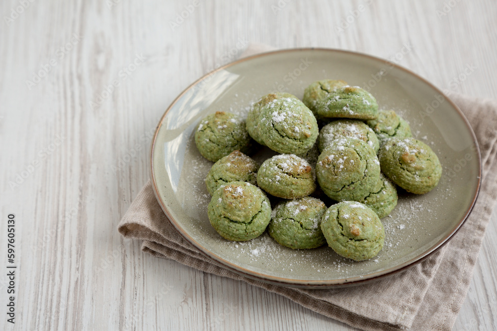 Homemade Soft Amaretti Cookies with Pistachio on a Plate, side view. Copy space. Homemade Soft Amaretti Cookies with Pistachio on a Plate, side view. Copy space.