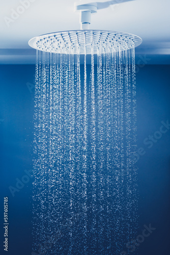 water drops falling from large rain shower head © nikkytok
