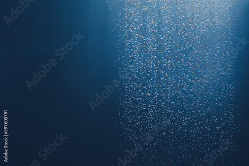 shower water drops in the bathroom, blue background with copy-space