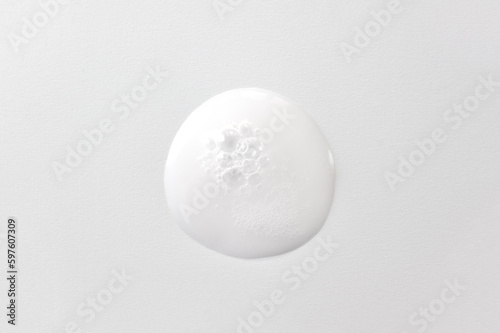 Drop of oxygen gel or serum on a white background. Sample of a cosmetic product. Selective focus.