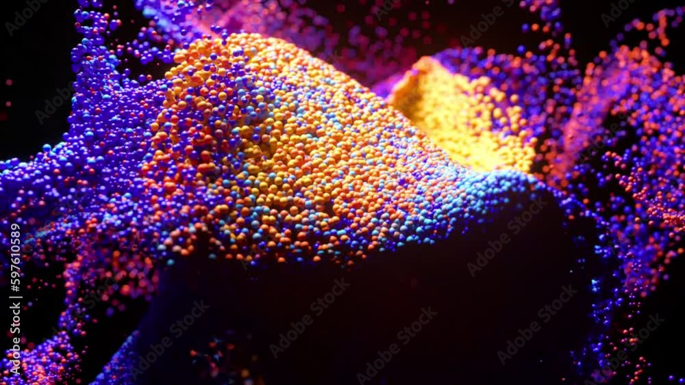Whirlwind of colored particles on a black isolated background. Video animation with surreal liquid color mixing splash