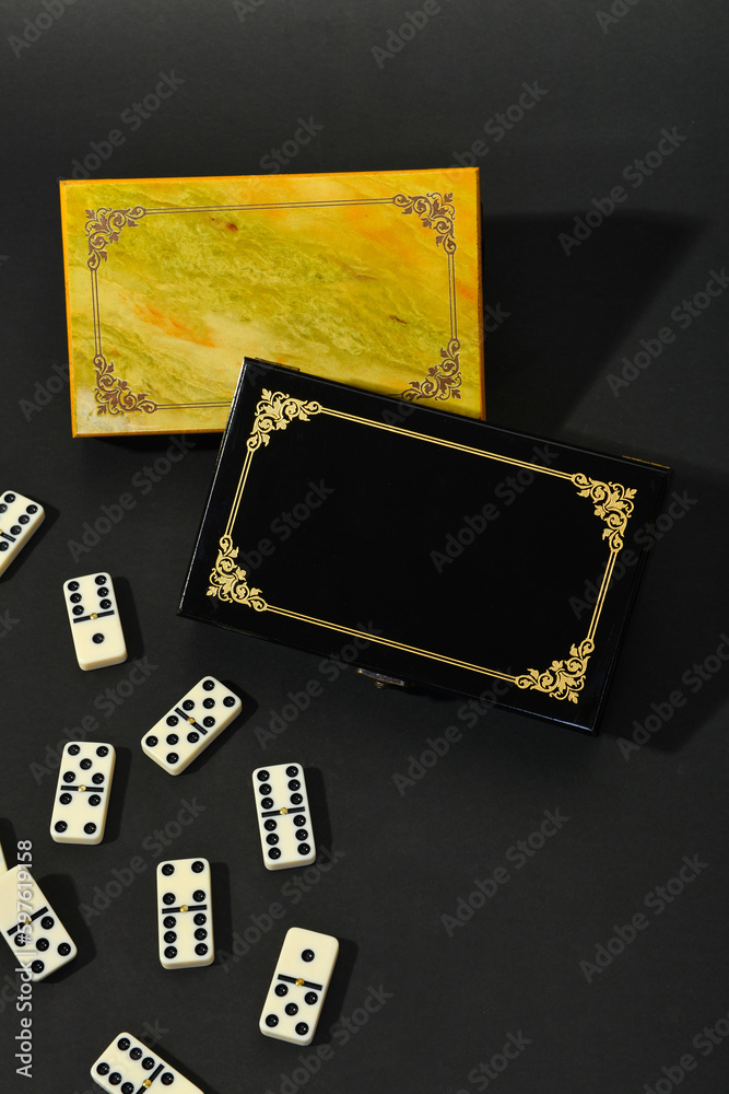 Obraz premium Dominoes on black background.