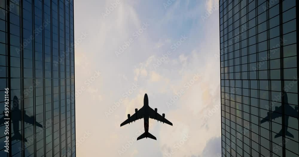 Airplane Flies Over Office Skyscrapers Against A Beautiful Blue Clouds

