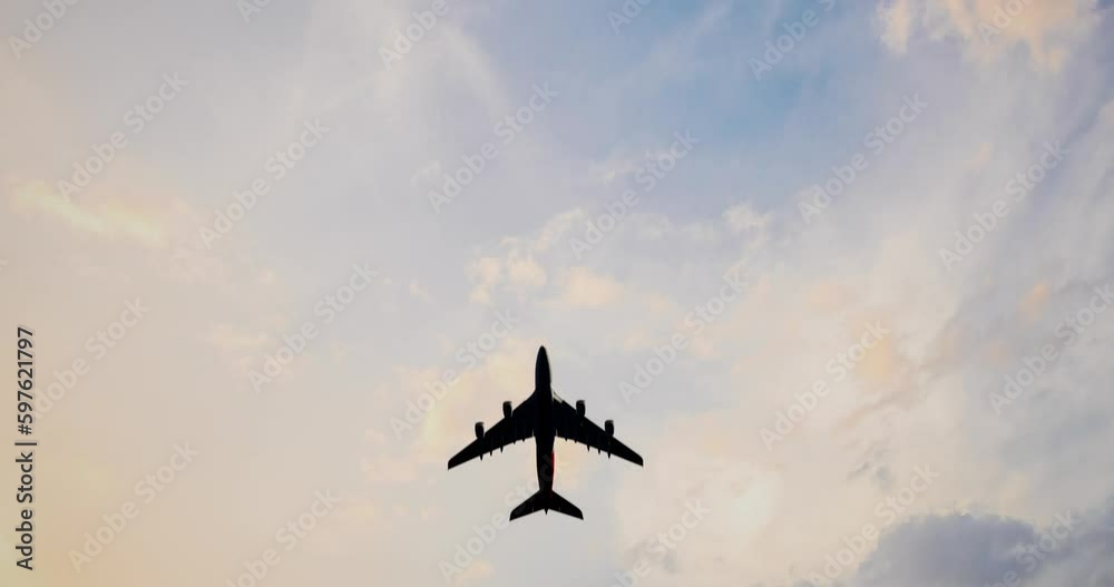 Overhead Flying Aircraft In The Blue Sky. The Plane With The Logo Express Delivery Service. The Sky And The Plane
