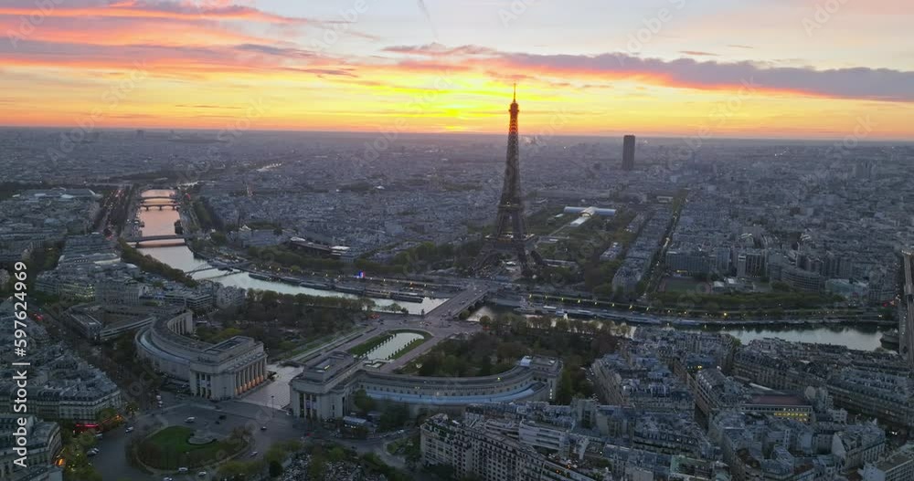 Beautiful view of famous Eiffel Tower in France with colorful twilight romantic sky. Wide establishing aerial morning sunrise or sunset of paris city center best travel destinations landmark in Europe Beautiful view of famous Eiffel Tower in France with colorful twilight romantic sky. Wide establishing aerial morning sunrise or sunset of paris city center best travel destinations landmark in Europe