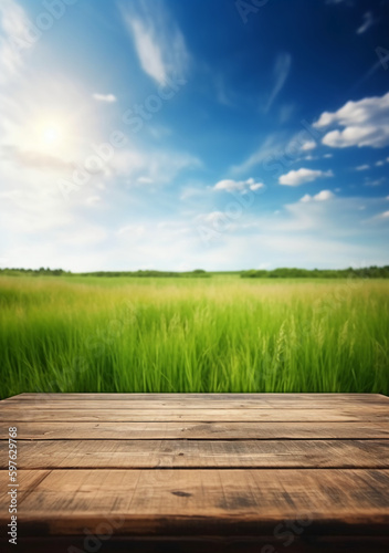 Spring summer beautiful background with green juicy young grass and empty wooden table in nature outdoor. Natural template landscape with blue sky and sun. AI generative