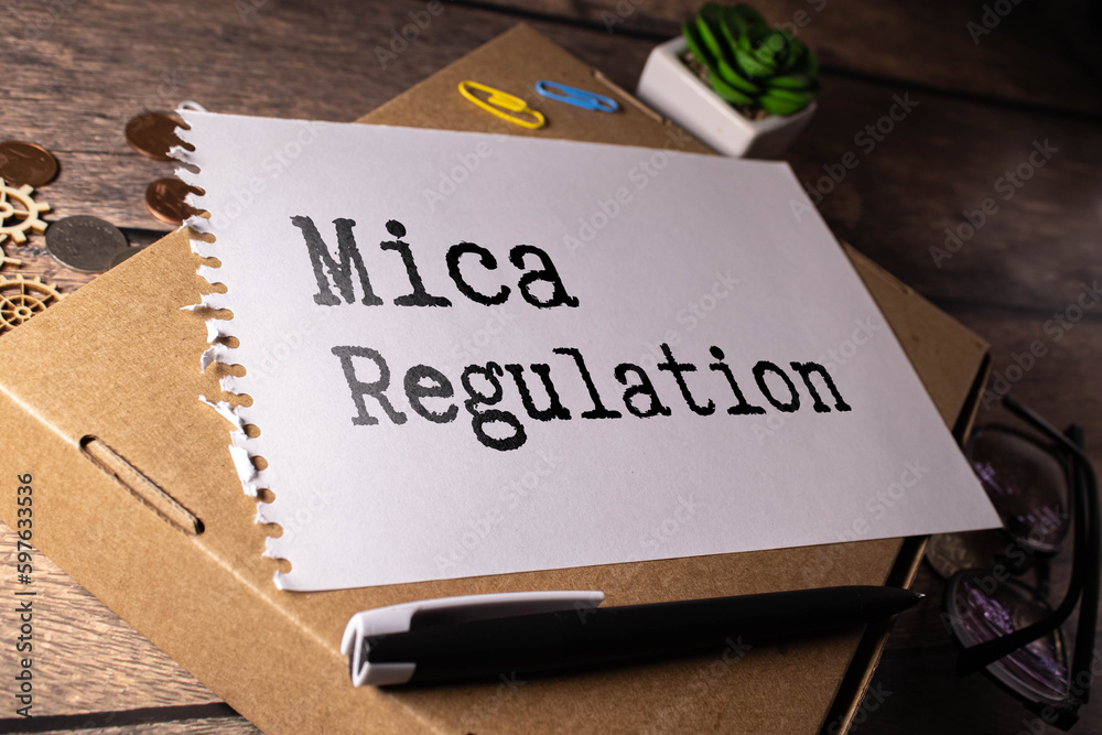 Markets in Crypto-Assets Regulation inscription on wooden blocks on dark background.
