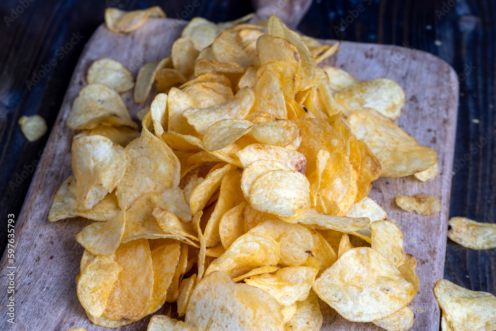 thin potato chips with spices, close up thin potato chips with spices, close up