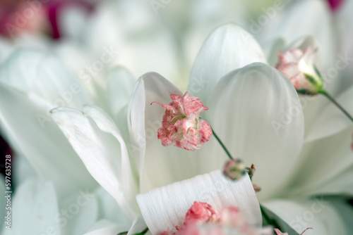 using different types of flowers to create a small bouquet for a holiday