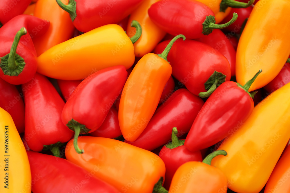 Yellow and red hot chili peppers as background, closeup Yellow and red hot chili peppers as background, closeup
