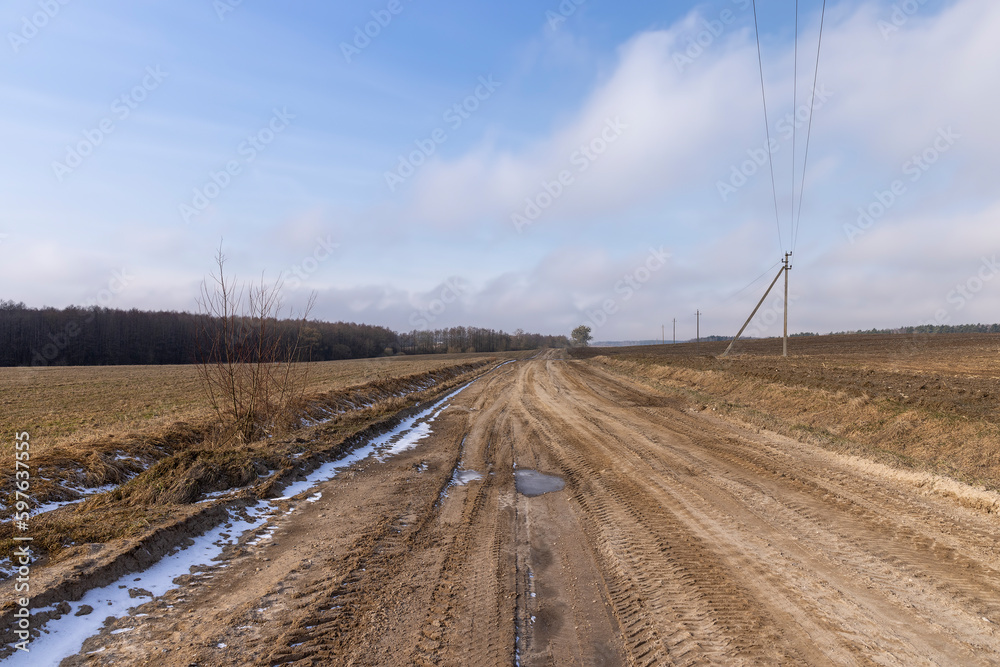 a broken country road at the beginning of spring a broken country road at the beginning of spring