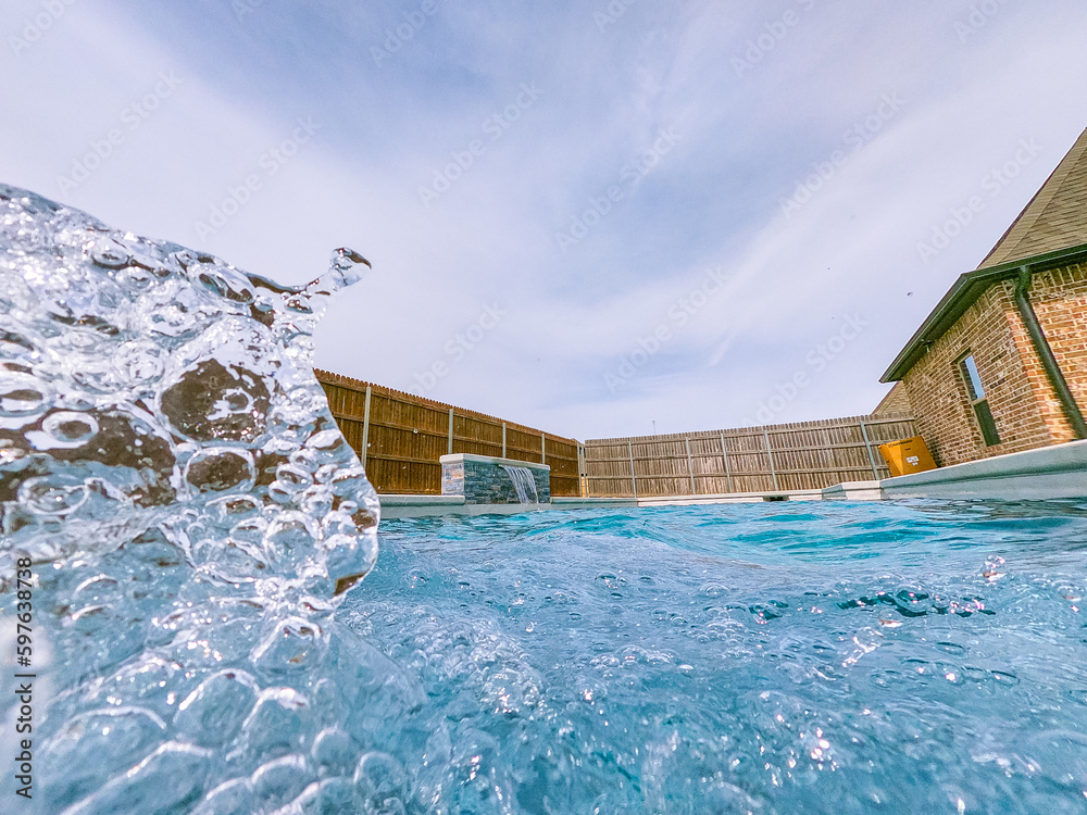 A serene photo capturing the perfect summer day with a vibrant swimming pool as the main focus, charmingly accompanied by a delightful duck enjoying a cool swim. A must-see for all nature and aquatic