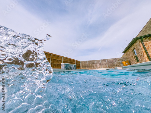 Obraz na płótnie A serene photo capturing the perfect summer day with a vibrant swimming pool as the main focus, charmingly accompanied by a delightful duck enjoying a cool swim. A must-see for all nature and aquatic w salonie