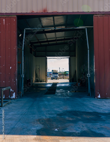 A bustling truck maintenance shop, providing comprehensive truck wash services and expert repair solutions for both trucks and trailers.