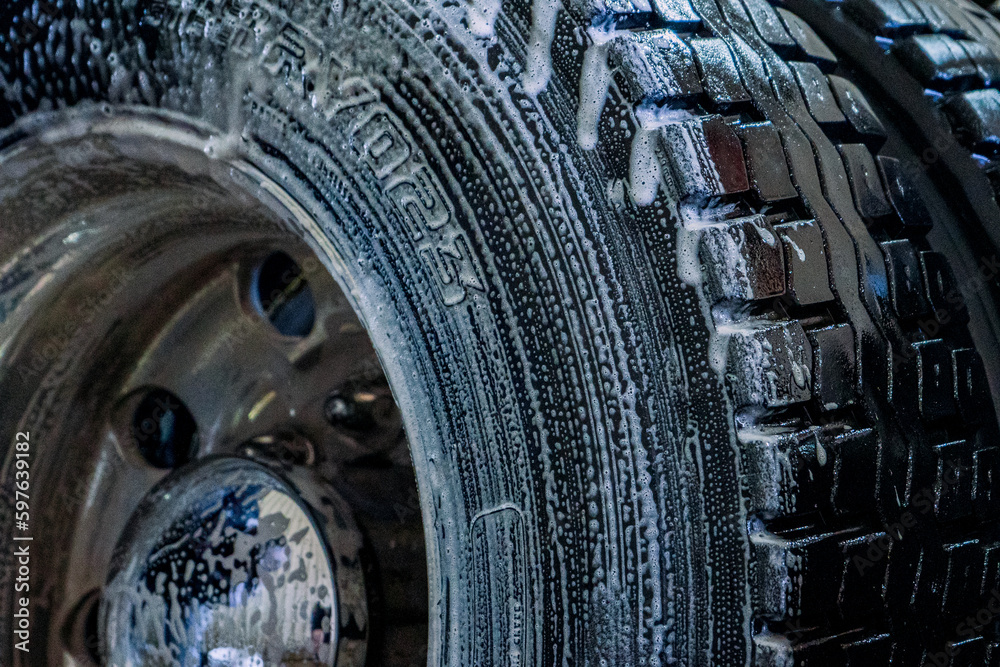 A bustling truck maintenance shop, providing comprehensive truck wash services and expert repair solutions for both trucks and trailers.