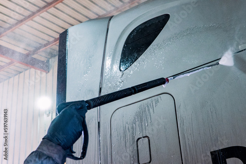 A bustling truck maintenance shop, providing comprehensive truck wash services and expert repair solutions for both trucks and trailers.
