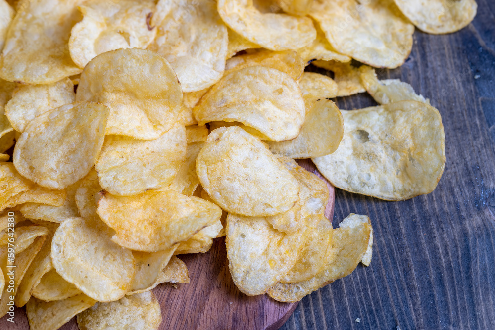 thin potato chips with spices, close up
