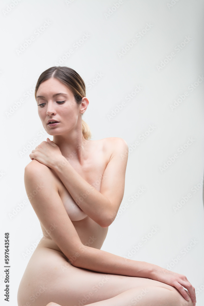beauty concept - Half-bust of naked woman covering herself. beauty concept - Half-bust of naked woman covering herself.