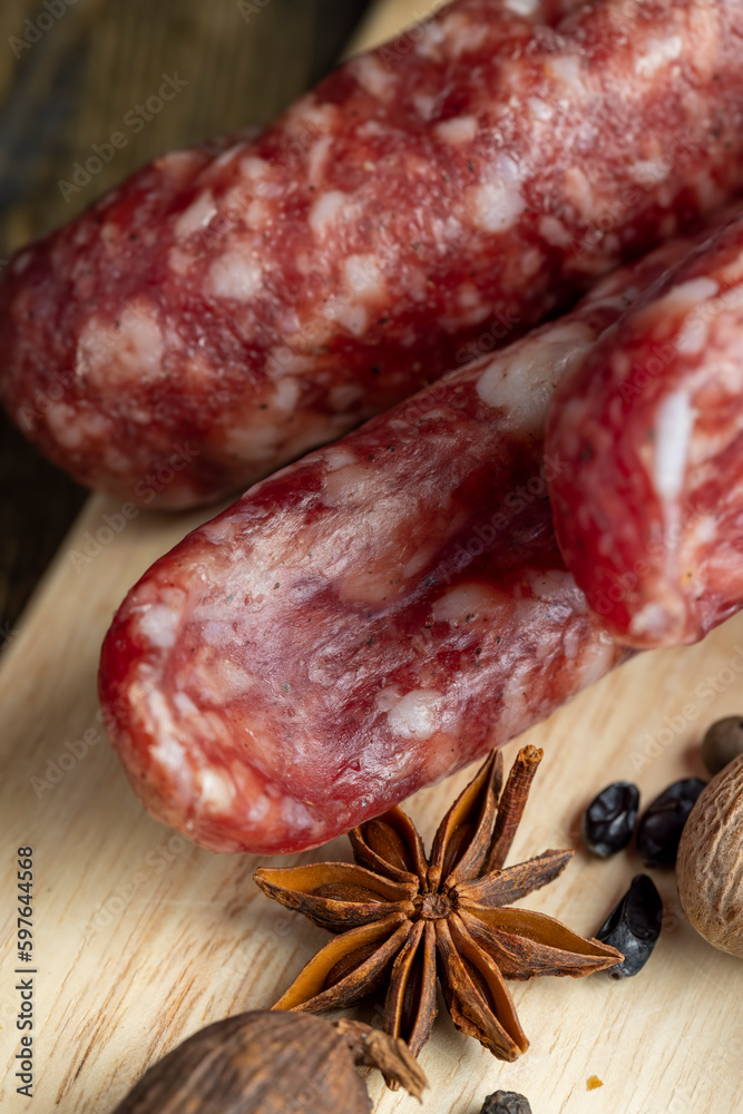 Dried pork sausage during slicing Dried pork sausage during slicing