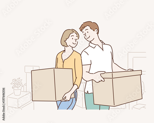 Happy young couple with cardboard boxes in their new house. Hand drawn style vector design illustrations.