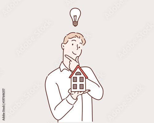 Hand holding home in palm. Hand drawn style vector design illustrations.