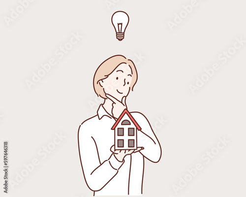 Hand holding home in palm. Hand drawn style vector design illustrations.