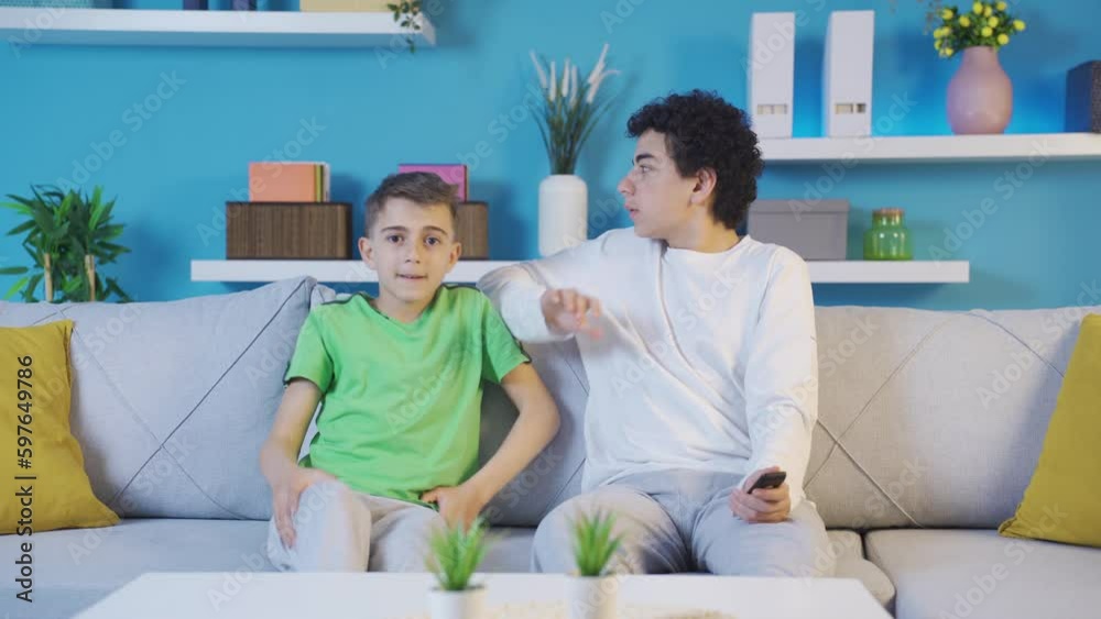 Two little brothers watching horror movies. Two little brothers watching horror movies.