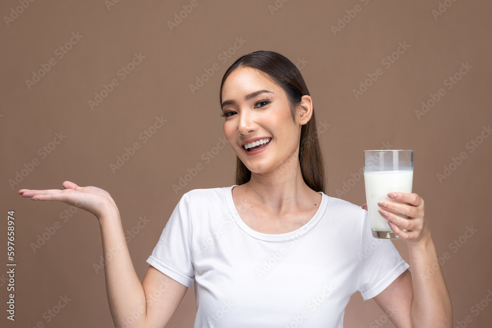 Asian beauty woman cute girl feel happy drinking milk for good health Happiness on Beige background. Asian beauty woman cute girl feel happy drinking milk for good health Happiness on Beige background.